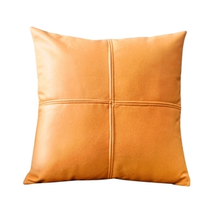 Modern orange faux leather square throw pillow cover with decorative cross stitching