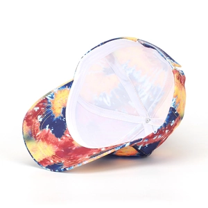 Detail view of the interior white lining and adjustable buckle of tie-dye baseball cap