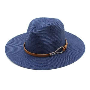 Detail of navy straw fedora hat with brown leather band and silver metal buckle