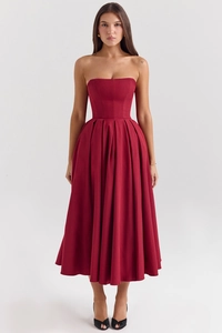 Detail of the high-waisted pleated hem on a wine red strapless midi dress for women