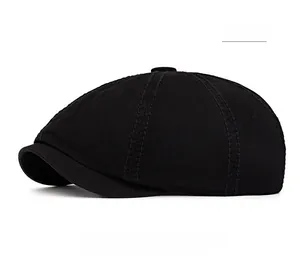 Detail view of black cotton octagonal beret hat with classic eight-panel stitching