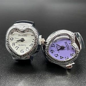 Chic heart-shaped quartz ring watch set with white and purple dials on textured background