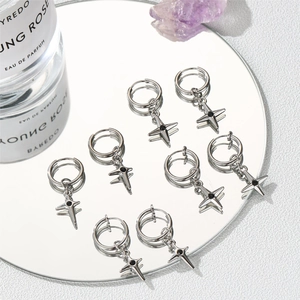 Star charm hoop earrings in silver steel with black zircon center on a mirror base