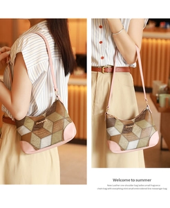 Detail of pink leather trim and geometric pattern on a stylish one-shoulder bag
