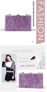 Detailed close-up of a purple marble acrylic clutch with gold metal chain and snap closure
