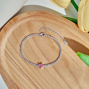 Detailed shot of S925 sterling silver tennis bracelet with pink heart cubic zirconia