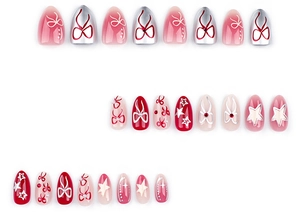 Detail of sweet bow and star press-on nails in red, pink, and silver glitter finishes