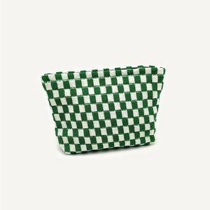 Green and white checkered knitted makeup bag with textured woven fabric on white background