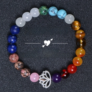 Top view of multi-color natural gemstone bead bracelet featuring a silver lotus charm