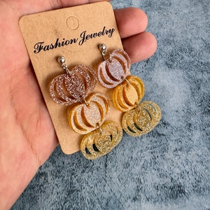 Three-tier glitter acrylic pumpkin drop earrings in rose gold and gold finishes