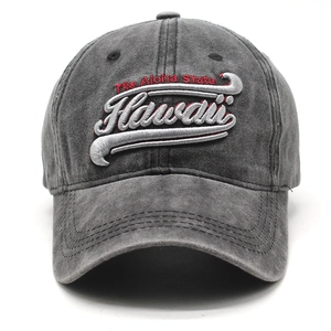 Detailed close-up of Hawaii embroidery on vintage washed dark gray denim baseball cap