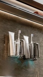 Close-up of wall-mounted bathroom organizer showing rapid drainage slots and ventilation holes