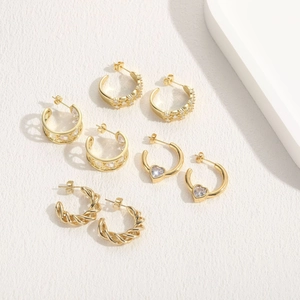 Set of four 14K gold plated earrings with heart patterns and zircon stone details