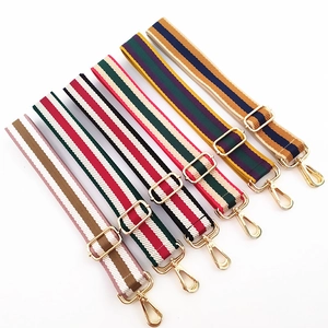 Adjustable striped fabric bag straps with gold metal hardware in various colors