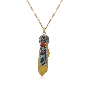 Detailed view of natural yellow crystal pendant with multi-color rhinestones and gold chain