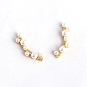 925 silver pearl branch earrings with diamonds in gold finish on white background