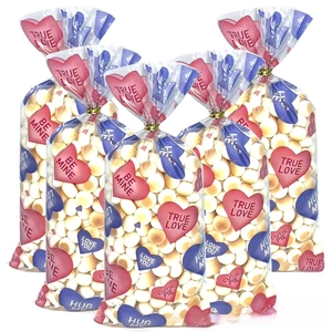Transparent Valentine candy bags with heart patterns and gold twist tie closures