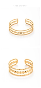 Detail of layered gold 304 stainless steel bangles with chain and bead textures