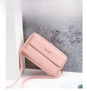 Detailed view of pink leather crossbody phone bag with Forever Lovely gold lettering