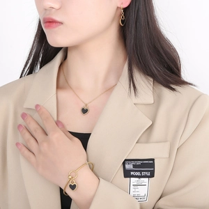 Golden titanium steel jewelry set with black heart lock pendants for women