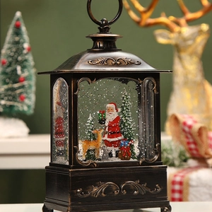 Vintage bronze Christmas lantern with Santa, reindeer, and swirling glitter inside
