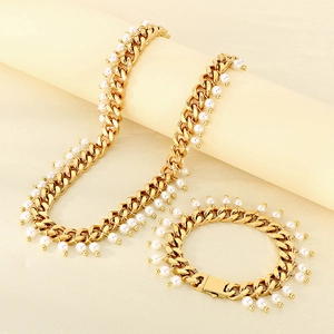 Detailed shot of 9mm gold Cuban chain jewelry set with pearl inlays and secure clasp