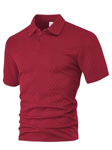 Detail of red men's polo shirt featuring textured diamond pattern fabric and collar