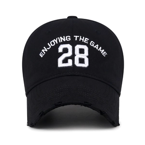 Distressed black baseball cap with white 28 embroidery and Enjoying the Game text