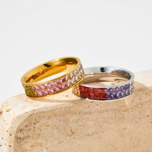 Colorful cubic zirconia full eternity rings in gold and silver plating on stone