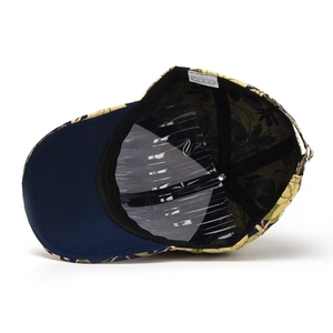 Close-up of floral baseball cap interior showing quality seams and 100% polyester care label