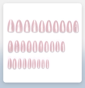 Detail of 28-piece almond cat-eye press-on nails set with shimmering pearl finish