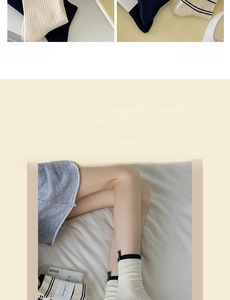 Detail showing knitted mid-calf socks in cream and navy stripes with brand tag