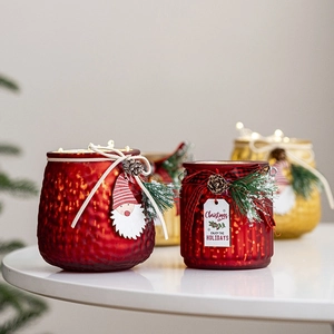 Christmas glass candle holder with pine cones and LED lights for festive table decor