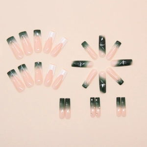 Dark green gradient press-on nails with marble texture and white star patterns
