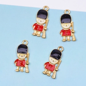 British royal guard soldier charm in red and black enamel with a gold-tone hanging loop