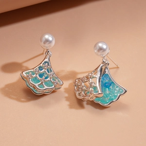 Silver fan-shaped pearl earrings with blue zircon inlays and shiny metal frames