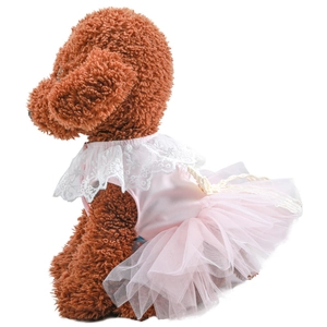 Detail of pink tiered mesh pet dress with white lace collar and delicate fabric textures