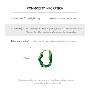 Detail of multi-strand green seed bead necklace with alloy lobster clasp and weight specs
