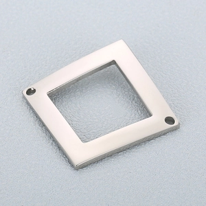 Detailed view of silver stainless steel geometric square frame connector with dual holes