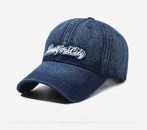 Side view of dark blue vintage denim baseball cap with New York City 3D embroidery detail