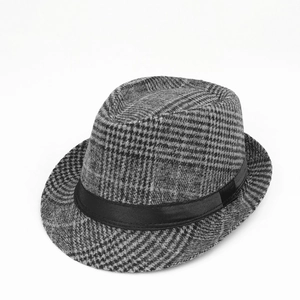 Detail of vintage fedora hat with black and grey plaid pattern and satin ribbon