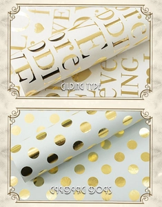 Detailed view of gilding gold dots and artistic letters on premium gift wrapping paper