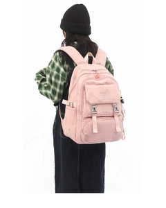 Pink school backpack for girls showing side storage and cute bear print details