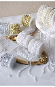 Detailed view of pearl and star bead rolls for French vintage jewelry and DIY crafts