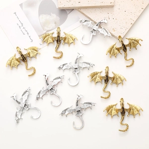 Retro dragon brooches in gold and silver finish with enamel and diamond accents