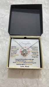 Detail of necklace gift set for daughter with heart pendant and emotional message card