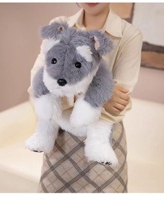 Detailed close-up of a cute plush Schnauzer toy with realistic grey and white faux fur