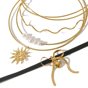 Multi-layer gold stainless steel choker set with pearl charms and sun bow pendants
