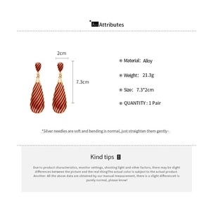 Detailed view of vintage zebra teardrop earrings with dimensions 7.3cm x 2cm
