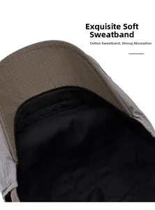 Detailed macro view of the soft cotton sweatband inside the grey twill newsboy cap
